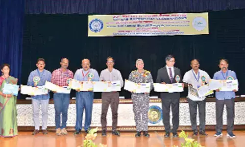 Vice Admiral Biswajit Dasgupta, among others, unveiling a coffee table book in Visakhapatnam on Friday