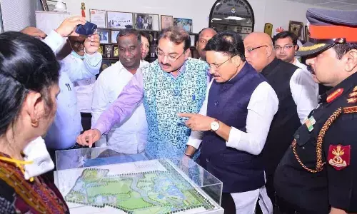 Union Minster of State for Information and Broadcasting Minister Dev Sinha Chauan examining the master plan of Bibinagar AIIMS  during his visit to college on Sunday
