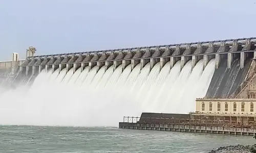 Flood water gushing out from Nagarjuna Sagar reservoir in Palnadu district on Sunday