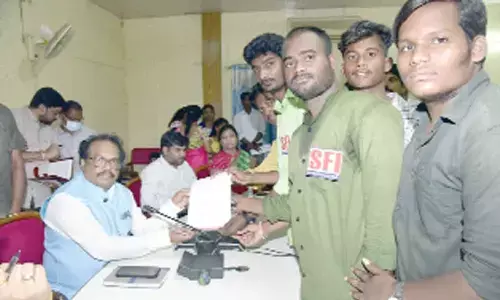 District Collector S Venkat Rao receiving submissions at the Prajavani programme in Mahbugnagar on Monday
