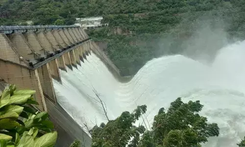 Srisailam dam officials lifted 10 radial crest gates to a height of 12 feet to release water downstream on Monday