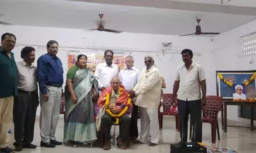 Poet and writer Gangeya Sastry being felicitated at a function at SKVT College, Rajamahendravaram, on Telugu Language Day  in Rajamahendravaram on Monday