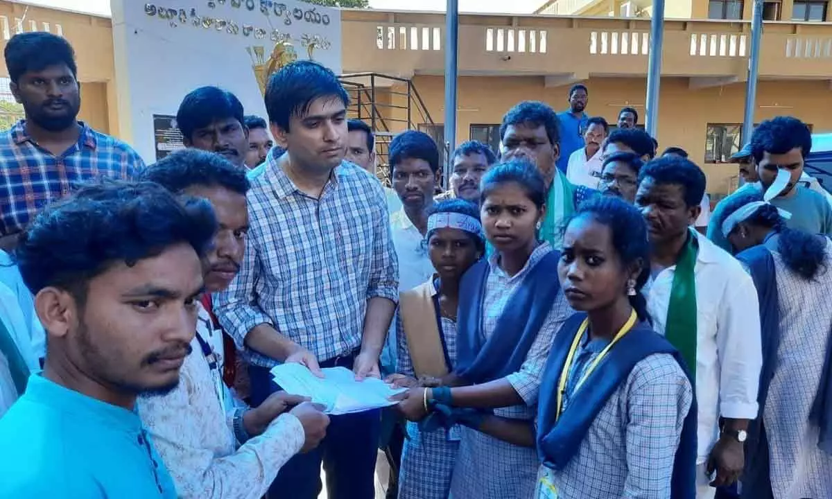 Students of Araku Womens College submitting a petition to District Collector Sumeet Kumar at the Collector Office on Friday