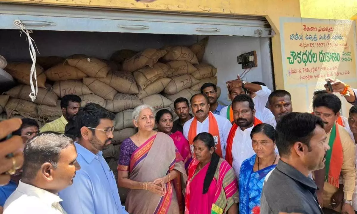 Union Finance Minister Nirmala Sitharaman at a ration shop in Birkoor village of Banswada town during her visit to the Zaheerabad Lok Sabha constituency  on Friday