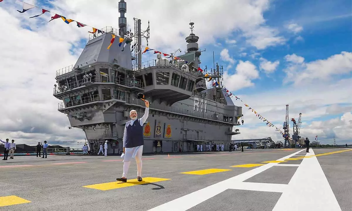 Prime Minister Narendra Modi during the commissioning ceremony of the first indigenously designed and built aircraft carrier, INS Vikrant, at Cochin Shipyard Limited in Kochi on Friday