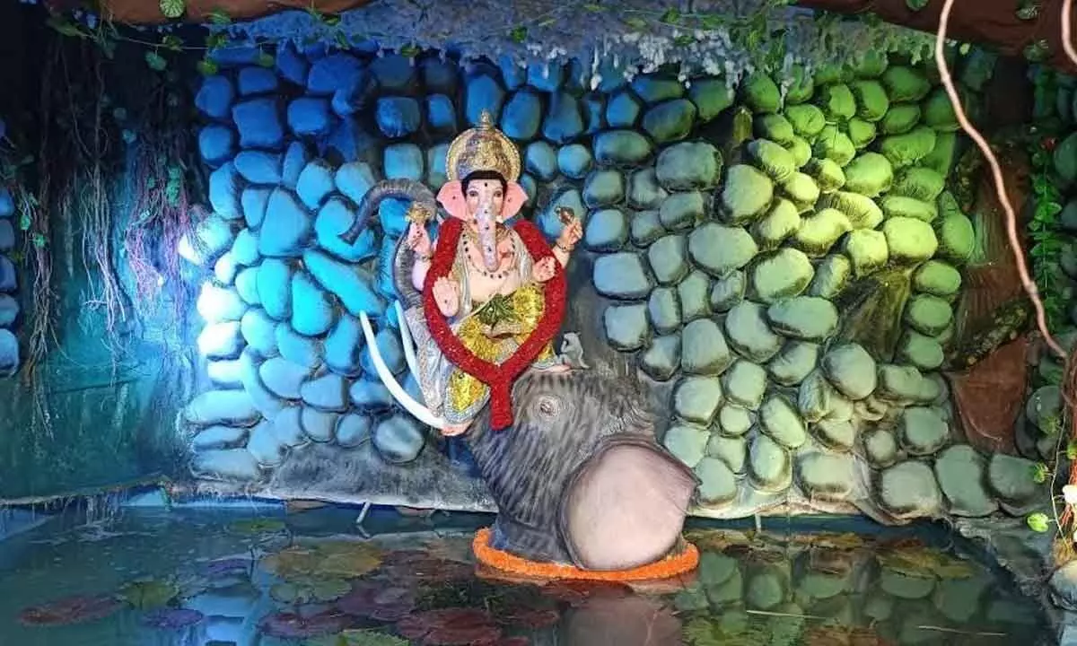 Ganesh idol mounted on an elephants trunk at a pandal in Adavivaram oil mill area in Visakhapatnam