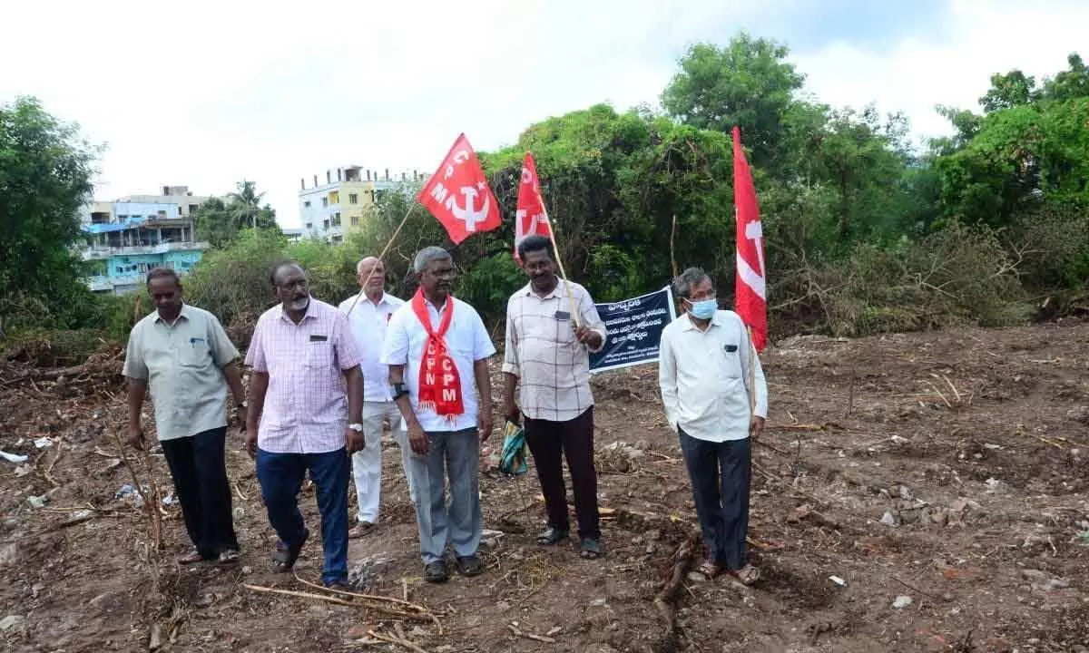 CPM leaders Ch Babu Rao, Donepudi Kasinath, B Ramana Rao and others at the Irrigation land of Budameru that was allegedly grabbed by the ruling party leaders, at Ramakrishnapuram in Vijayawada on Friday