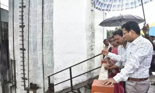 Prakasam District Collector AS Dinesh Kumar and officials inspecting the damaged gate on Friday
