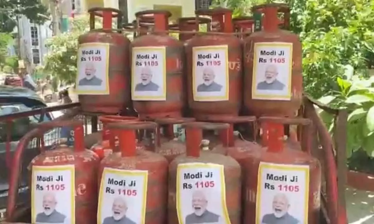 TRS hits back at Nirmala with PMs photos on LPG cylinders