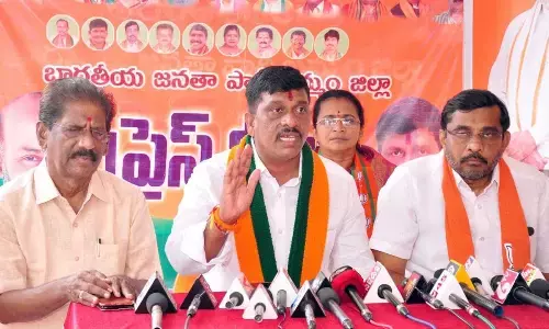BJP district president Galla Satyanarayana speaking to the media in Khammam on Sunday