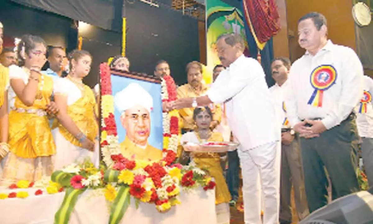 Deputy Chief Minister K Narayana Swamy paying floral tributes to the portrait of Dr Sarvepalli Radhakrishnan on the occasion of Teachers’ Day celebrations in Tirupati on Monday. Collector K Venkataramana Reddy is also seen.