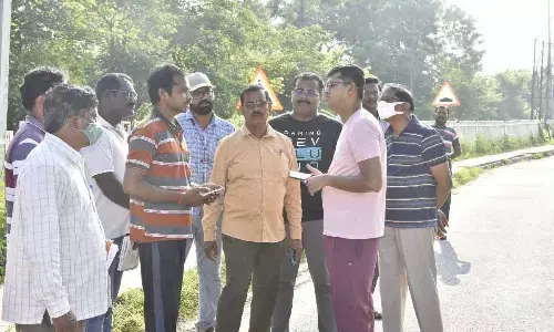 Vijayawada Municipal Commissioner  Swapnil Dinkar Pundkar inspecting greenery works on national highway in Vijayawada  on Tuesday