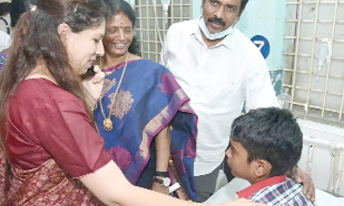 District Collector Krithika Shukla interacting with a effected student at Government Hospital in Kakinada on Wednesday
