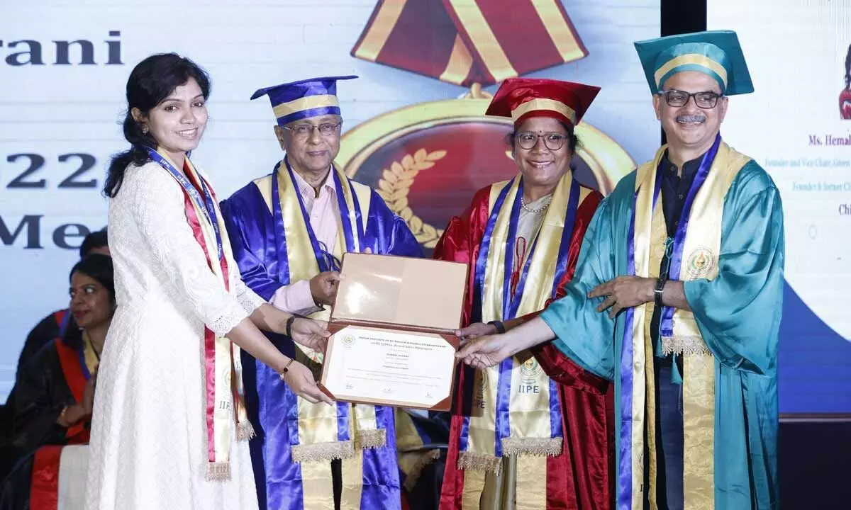 Guests presenting an award along with degree to a student during the second convocation of IIPE in Visakhapatnam on Wednesday