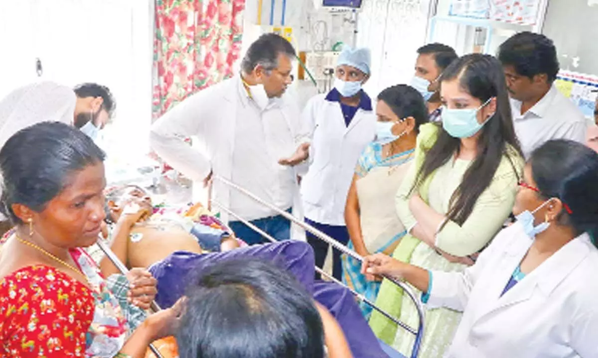 Tirupati municipal commissioner Anupama Anjali visits an injured student at SVIMS hospital