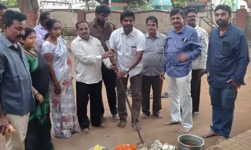 GVMC corporator P Murthy Yadav laying a foundation stone for the development works in Visakhapatnam on Wednesday