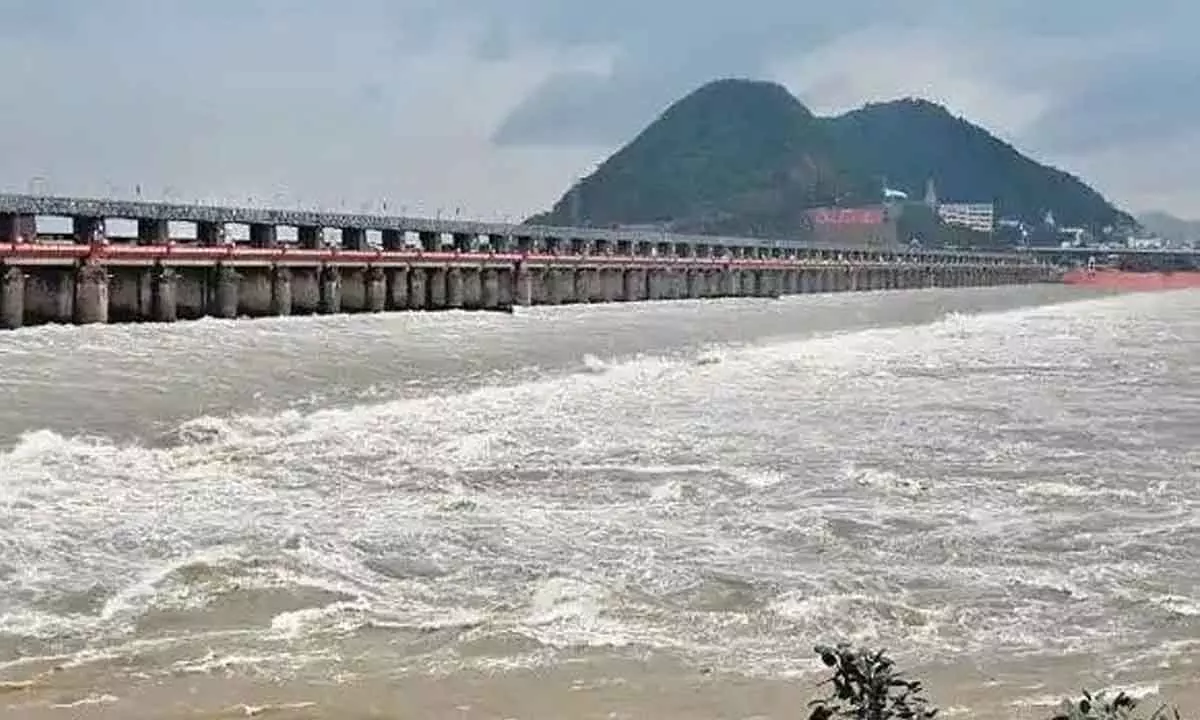 Floodwater gushing out from Krishna Barrage in Vijayawada on Thursday