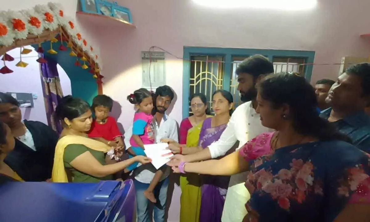 AP Women Commission Chairperson Vasireddy Padma, District Collector K Madhavi Latha and MP Bharat handing over the compensation cheque to the children on Thursday