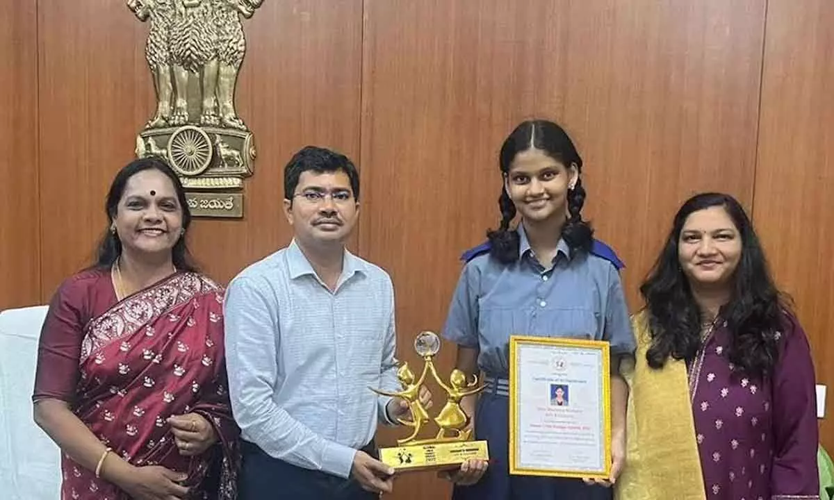 Visakhapatnam District Collector A Mallikarjuna congratulating Sharanya Mudundi on winning ‘Global Child Prodigy Award’