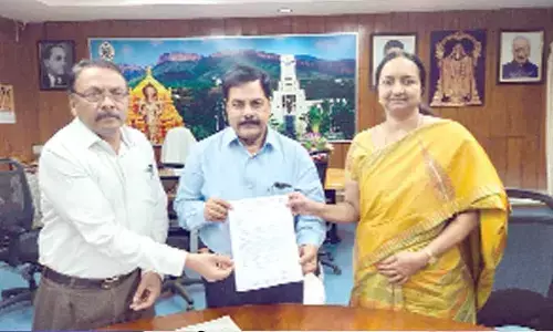 SV University vice-chancellor Prof K Raja Reddy, registrar Prof O Md Hussain and Dr K V Suchaitha showing the project sanctioning letter on Thursday