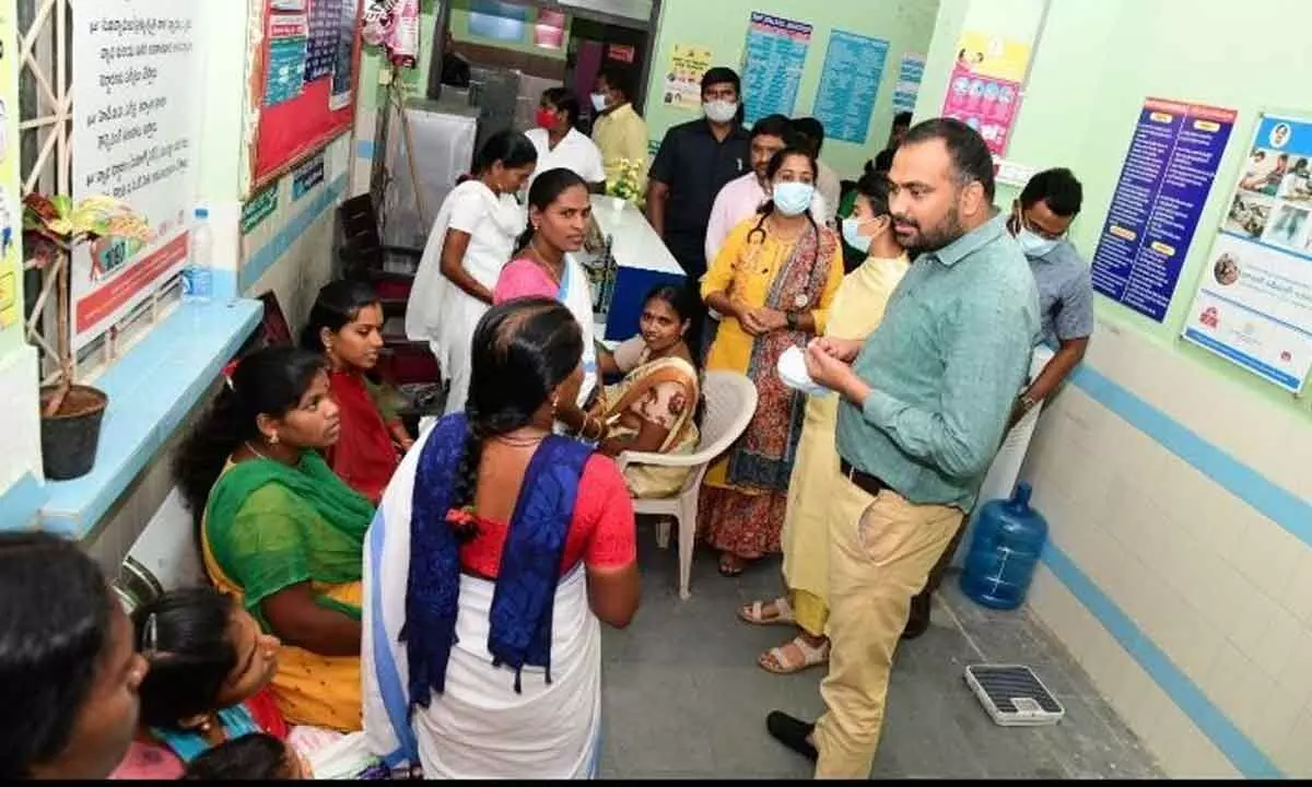 Collector RV Karnan interacting with women at Manakondur Mandal Primary Health Centre in Karimnagar district on Friday