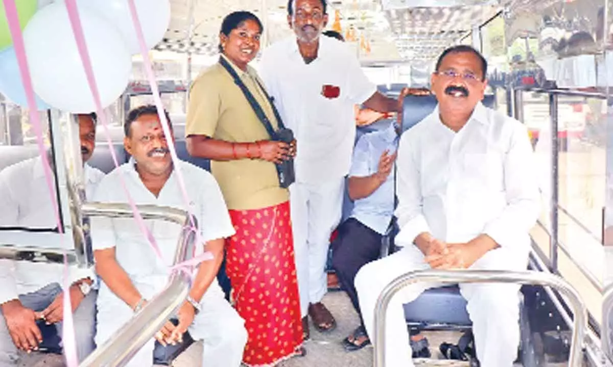 MLA Bhumana Karunakar Reddy and Deputy Mayor Mudra Narayana travelling in the newly inaugurated Rayachoti-Tirupati bus service, in Tirupati on Friday