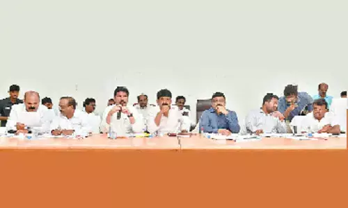 Minister Jogi Ramesh discussing the pending works of highways with the officials in Machilipatnam on Friday. Machilipatnam MP V Balasouri, MLAs Perni Nani and Kolusu Parthasarathy, District Collector P Ranjith Basha and others are also seen.