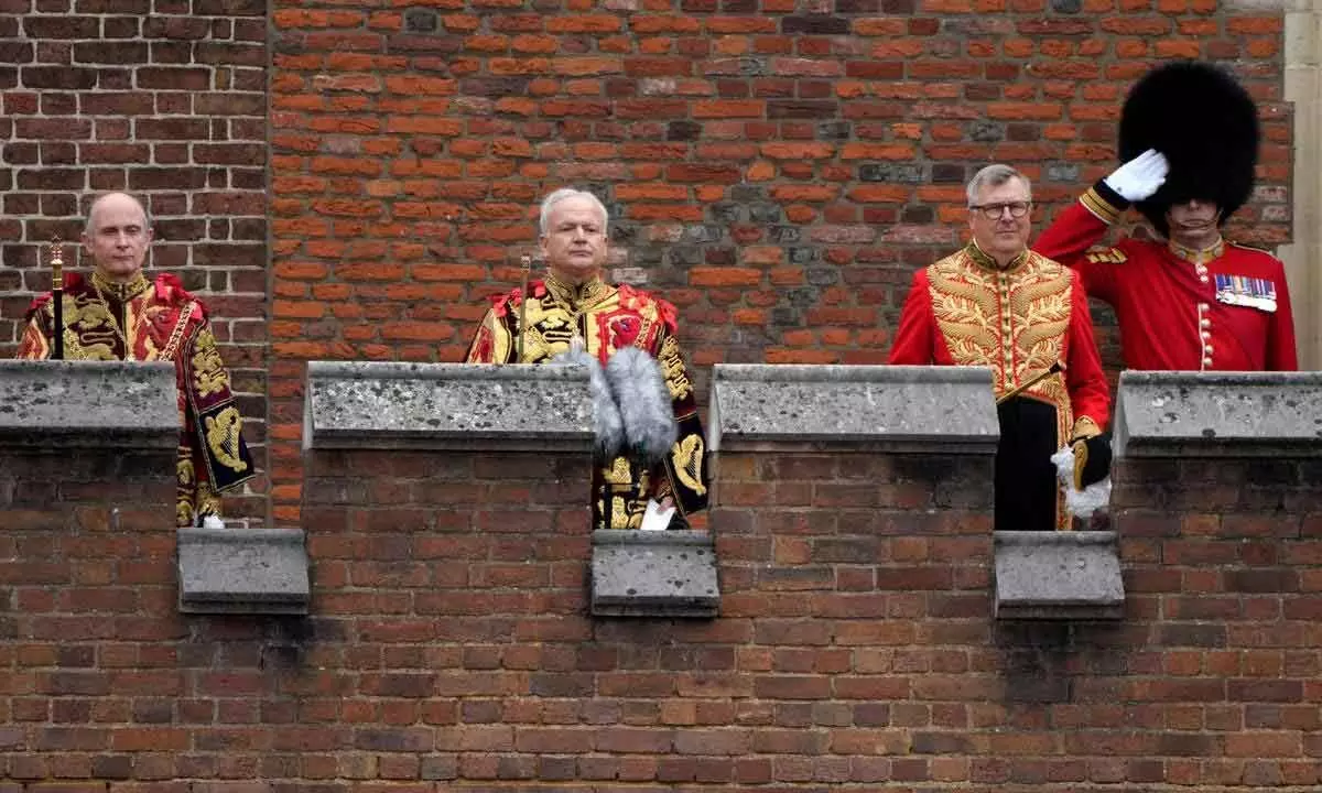 Garter Principle King of Arms, David Vines White (center) reads the proclamation of new king as  King Charles III at St Jamess Palace in London on Saturday