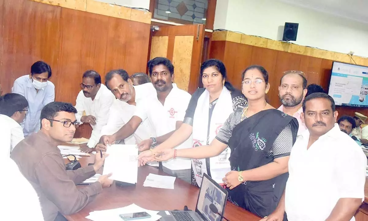 JSP corporator P Murthy Yadav along with others submitting a representation to Joint Collector KS Viswanathan in Visakhapatnam on Monday