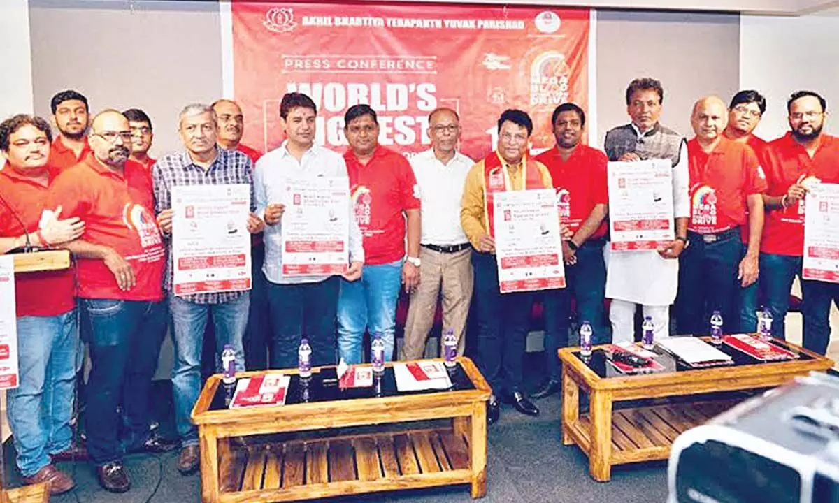 DRM, Waltair Division Anup Satpathy, ABTYP members, and others at the poster launch of the mega blood donation drive in Visakhapatnam on Thursday