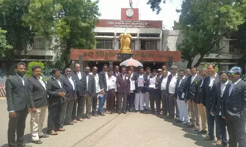 Advocates staging a protest in front of the Collectorate in Kurnool on Thursday