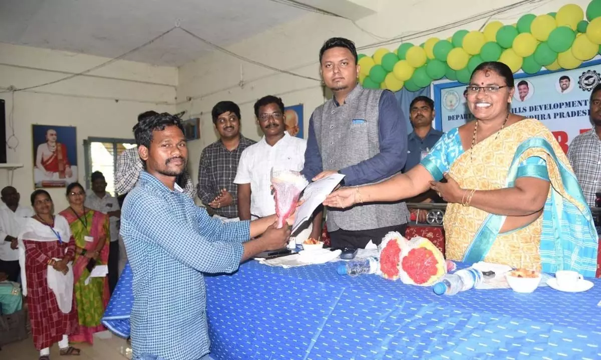 Collector Nishanth Kumar giving appointment letters to the candidates selected in Job Mela