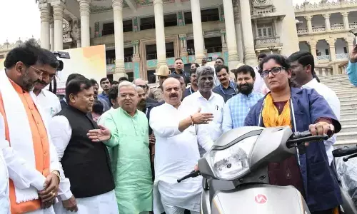 Basavaraj Bommai distributes electric two-wheelers to safai karmacharis