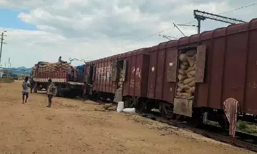 Rice bags being loaded into a wagon at Niduguntapalem