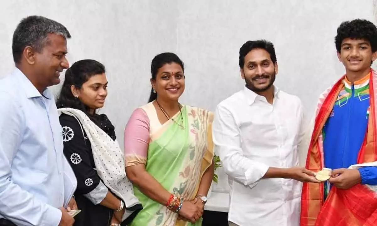International junior Karate champion A Kartik Reddy along with his family meets Chief Minister Y S Jagan Mohan Reddy in Tadepalli on Thursday. Minister for sports R K Roja is also seen.