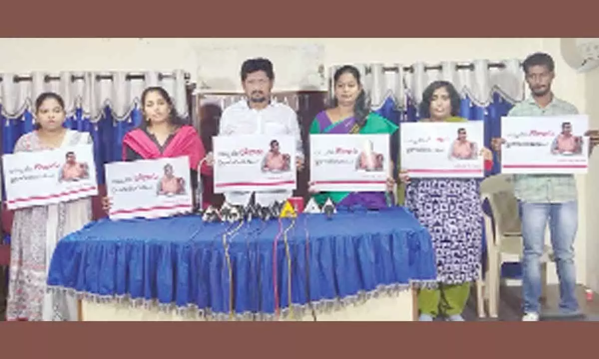 Jana Sena leaders showing placards against Minister R K Roja in Tirupati on Thursday