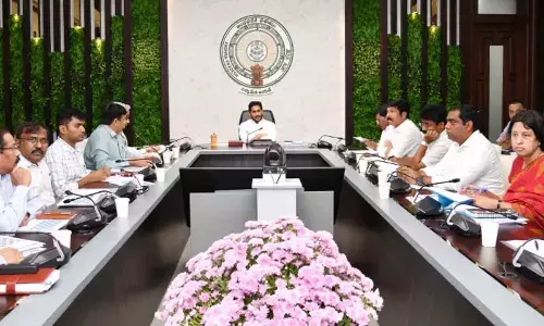Chief Minister Y S Jagan Mohan Reddy reviews progress in housing works at his camp office in Tadepalli on Thursday