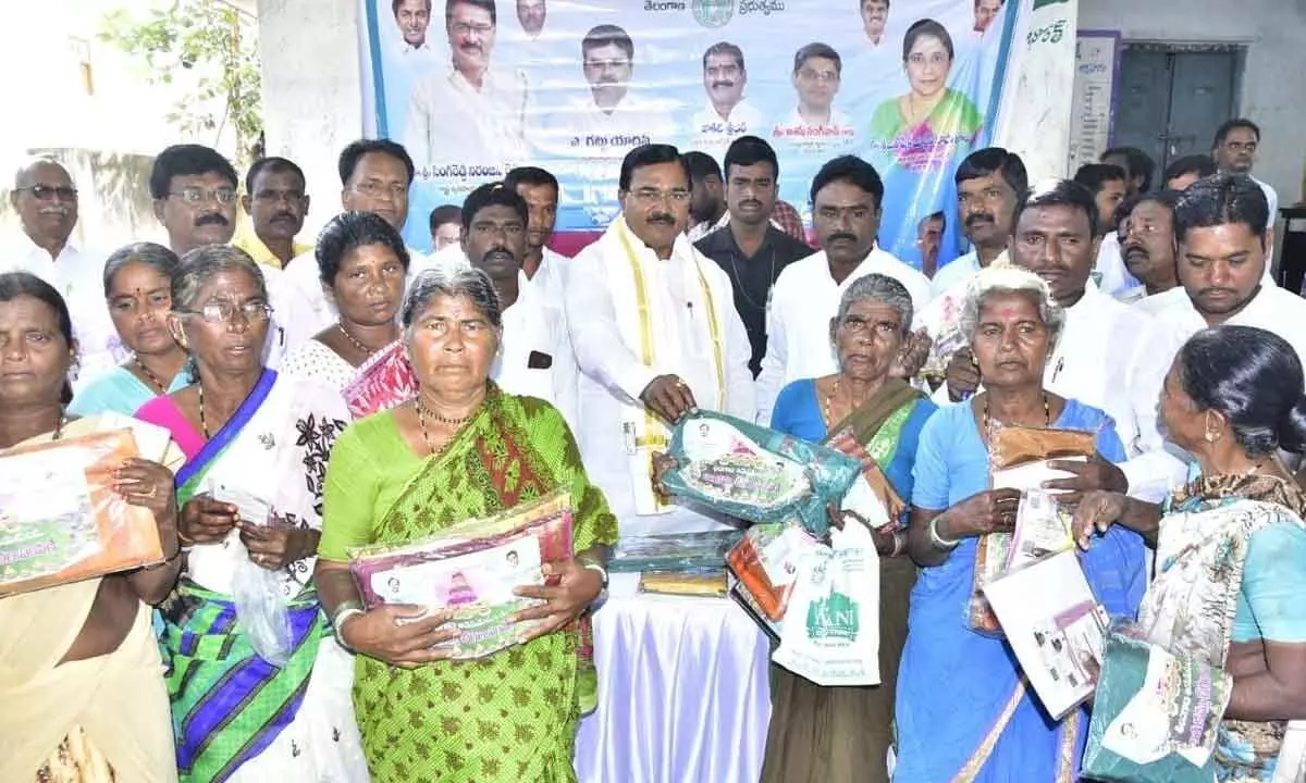 Minister Singireddy Niranjan Reddy distributes new pension ID cards and Bathukamma sarees
