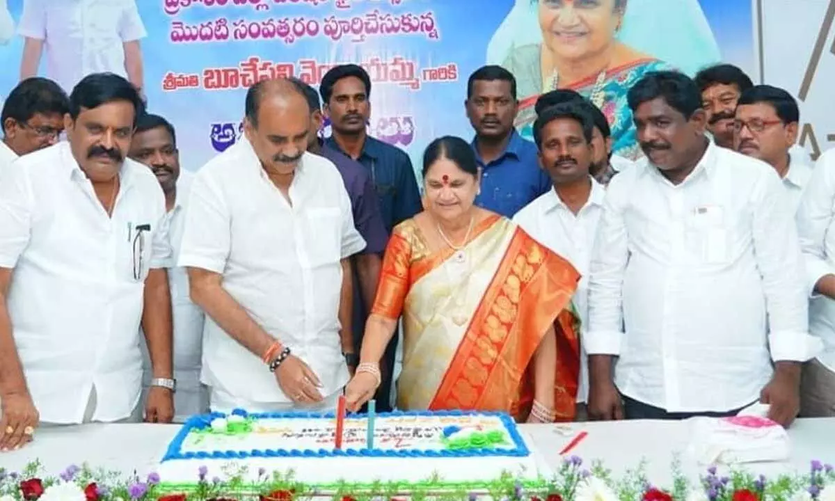Krishna district ZP Chairperson Uppala Harika and members cutting a cake marking completion of one year term, in Machilipatnam on Sunday