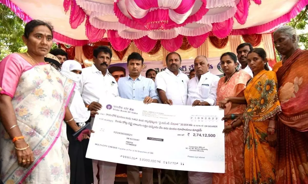 MLA G Srikanth Reddy along with Collector P S Girisha distributing replica of cheque under YSR Cheyutha Scheme in Rayachoti on Sunday