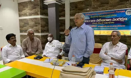 Former Irrigation Secretary D Chakrapani addressing the conference