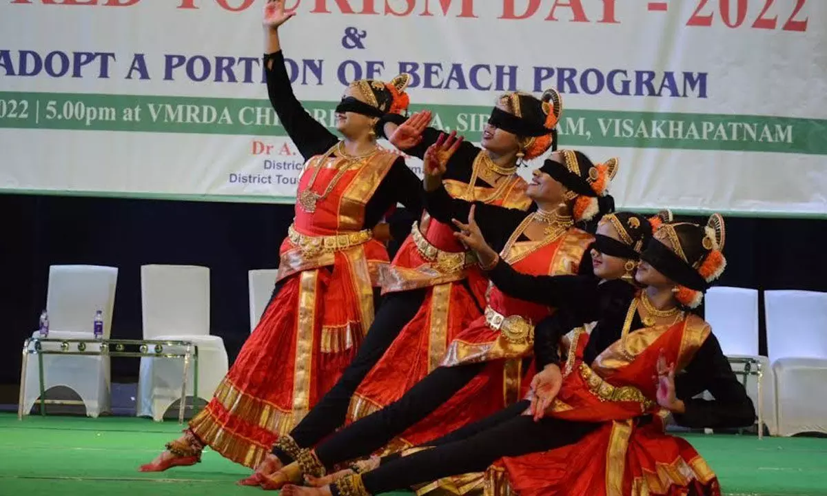 A group of artistes performing dance on the occasion of the World Tourism Day at VMRDA Children’s Arena in Visakhapatnam on Tuesday