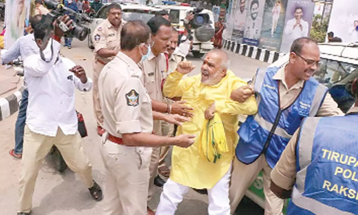 TDP corporator R C Munikrishna being detained by police in Tirupati on Tuesday