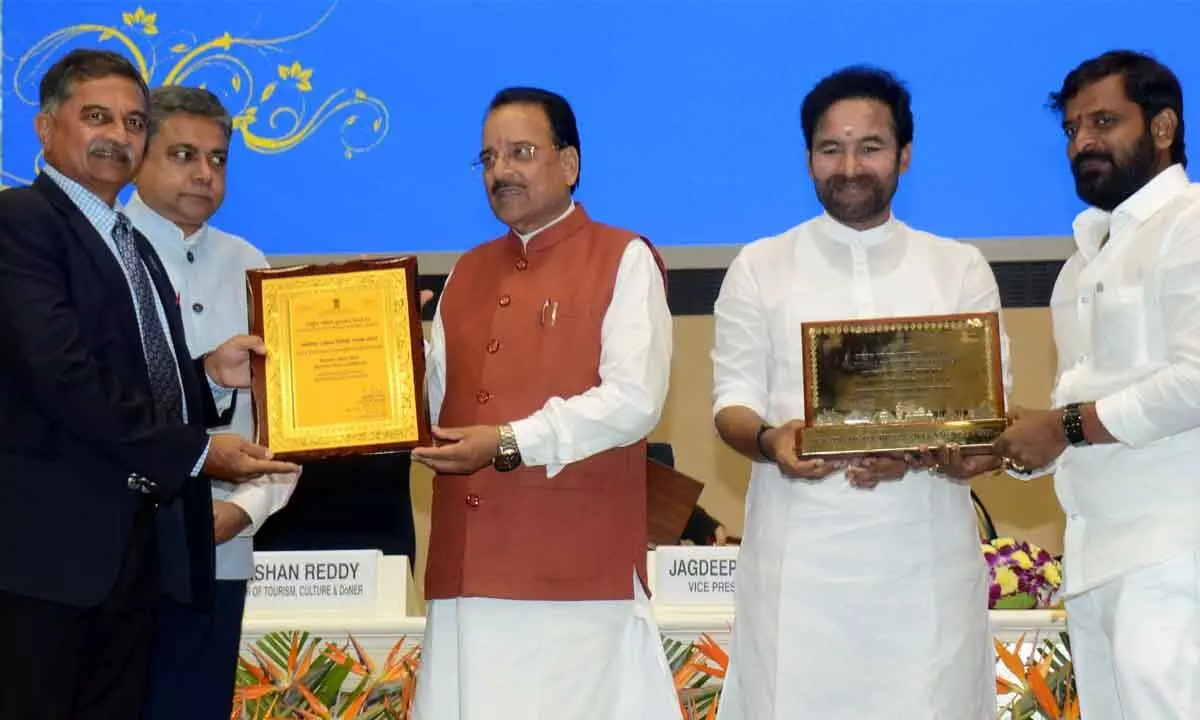 Union Tourism Minister G Kishan Reddy presenting National Tourism Award to Minister V Srinivas Goud
