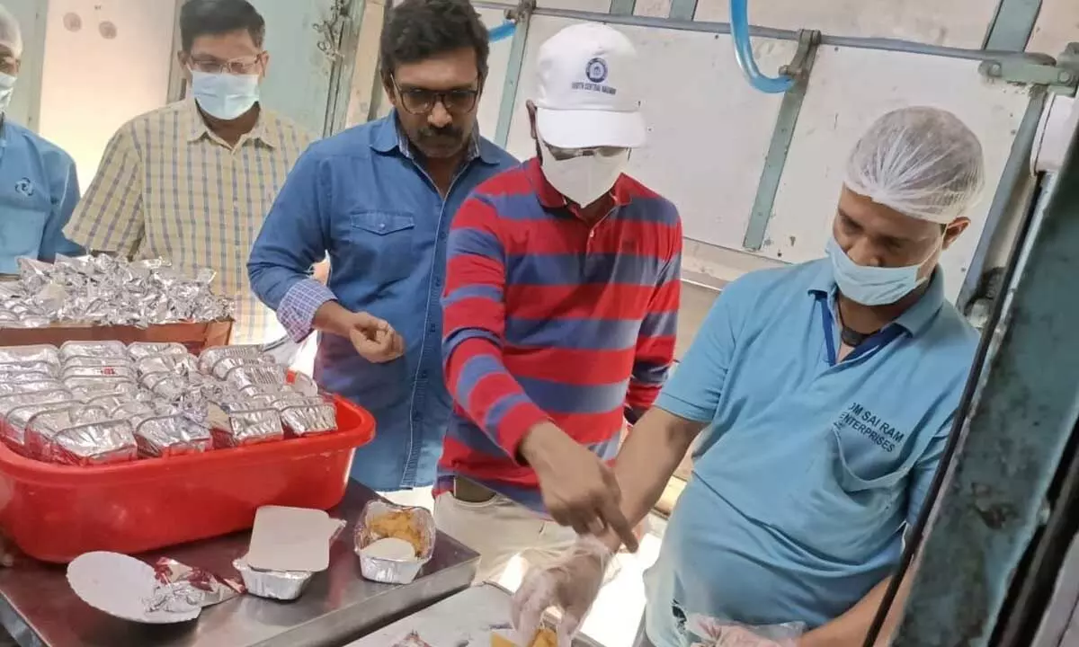 Division railway officials inspecting quality of food items served to passengers in Vijayawada on Tuesday