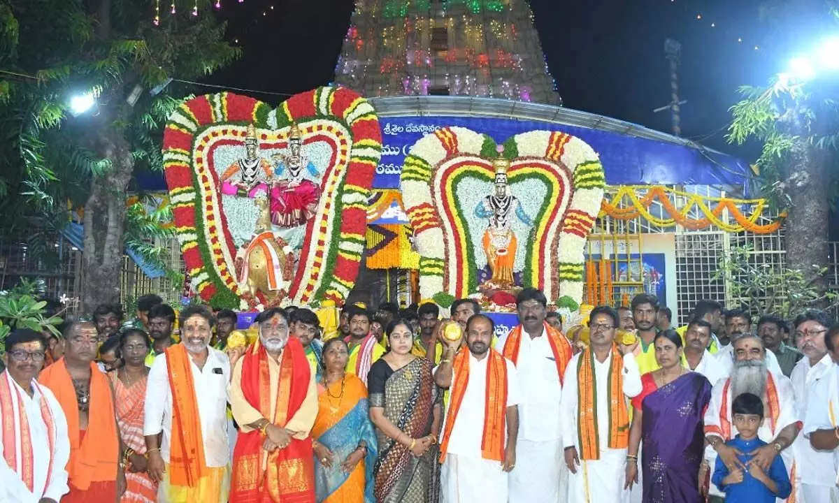 Srisailam temple EO S Lavanna and others taking part in Mayura Vahana Seva at Srisailam on Tuesday