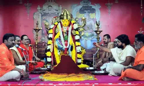 Priests performing kumkum puja to Goddess Kanaka Durga at the temple atop Indrakeeladri in Vijayawada on Tuesday  								Photo: Ch Venkata Mastan