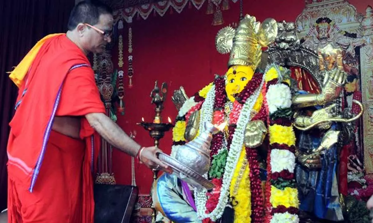A priest offering harathi to Goddess Kanaka Durga at Sri Durga Malleswara Swamy temple in Vijayawada on Wednesday 	Photo: Ch Venkata Mastan