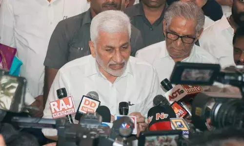 YSRCP MP V Vijayasai Reddy speaking to the media at the YSRCP central office in Tadepalli on Wednesday. Senior YSRCP leader Ummareddy Venkateswarlu is also seen.