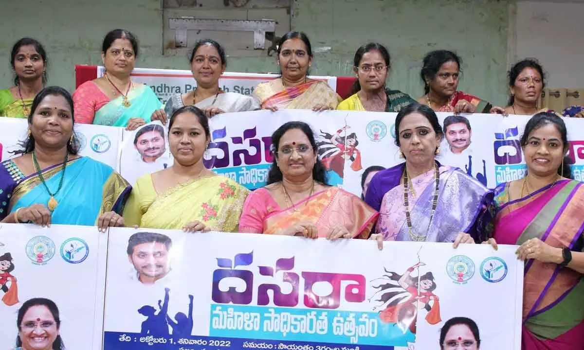 State Women Commission Chairperson Vasireddy Padma along with women conductors displaying posters of Dasara Women Empowerment Festival in Rajamahendravaram on Thursday